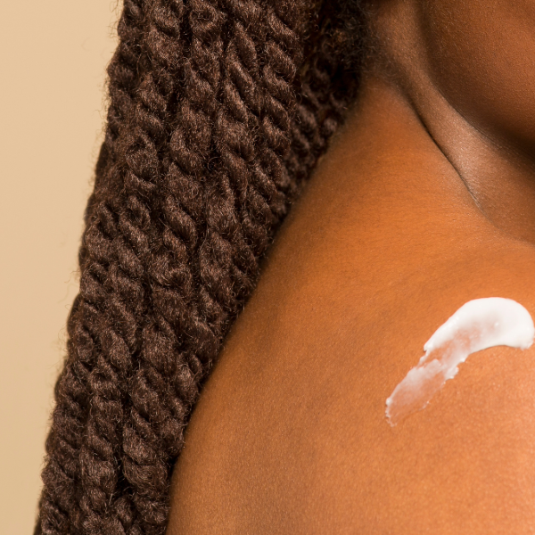 woman with skincare applied to her shoulder | mindful beauty magazine